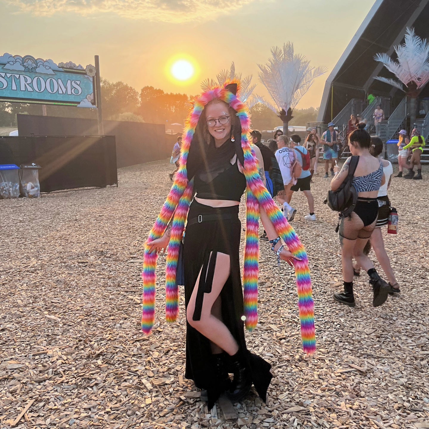 Model at Electric Forest wearing rainbow faux fur tentacle hood.