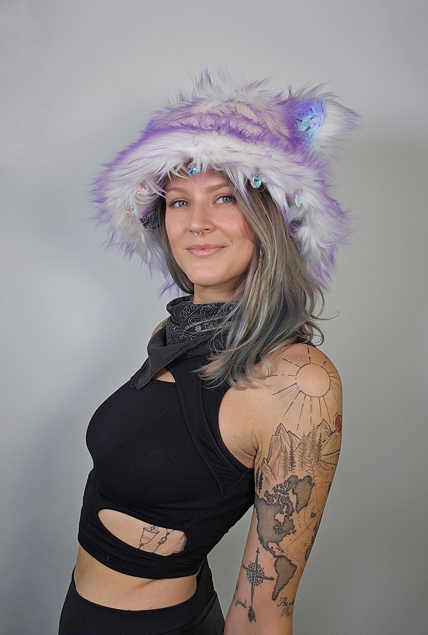 Person wearing a colorful fur hat with ears