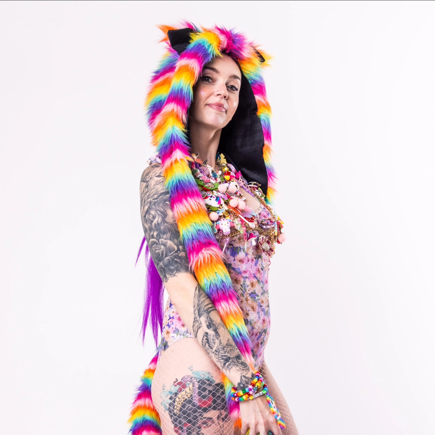Woman wearing rainbow faux fur hood