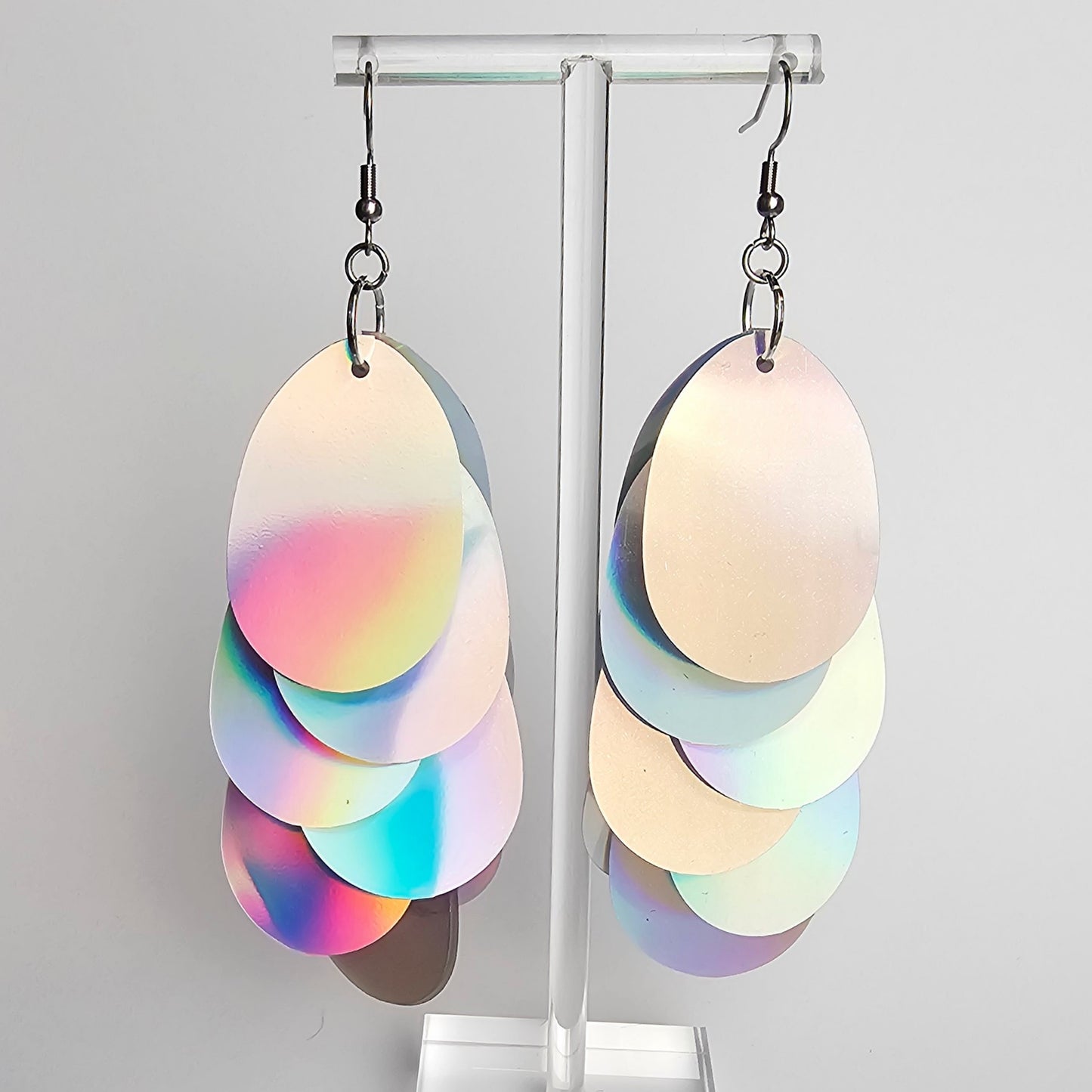 Earrings with large silver iridescent sequins.