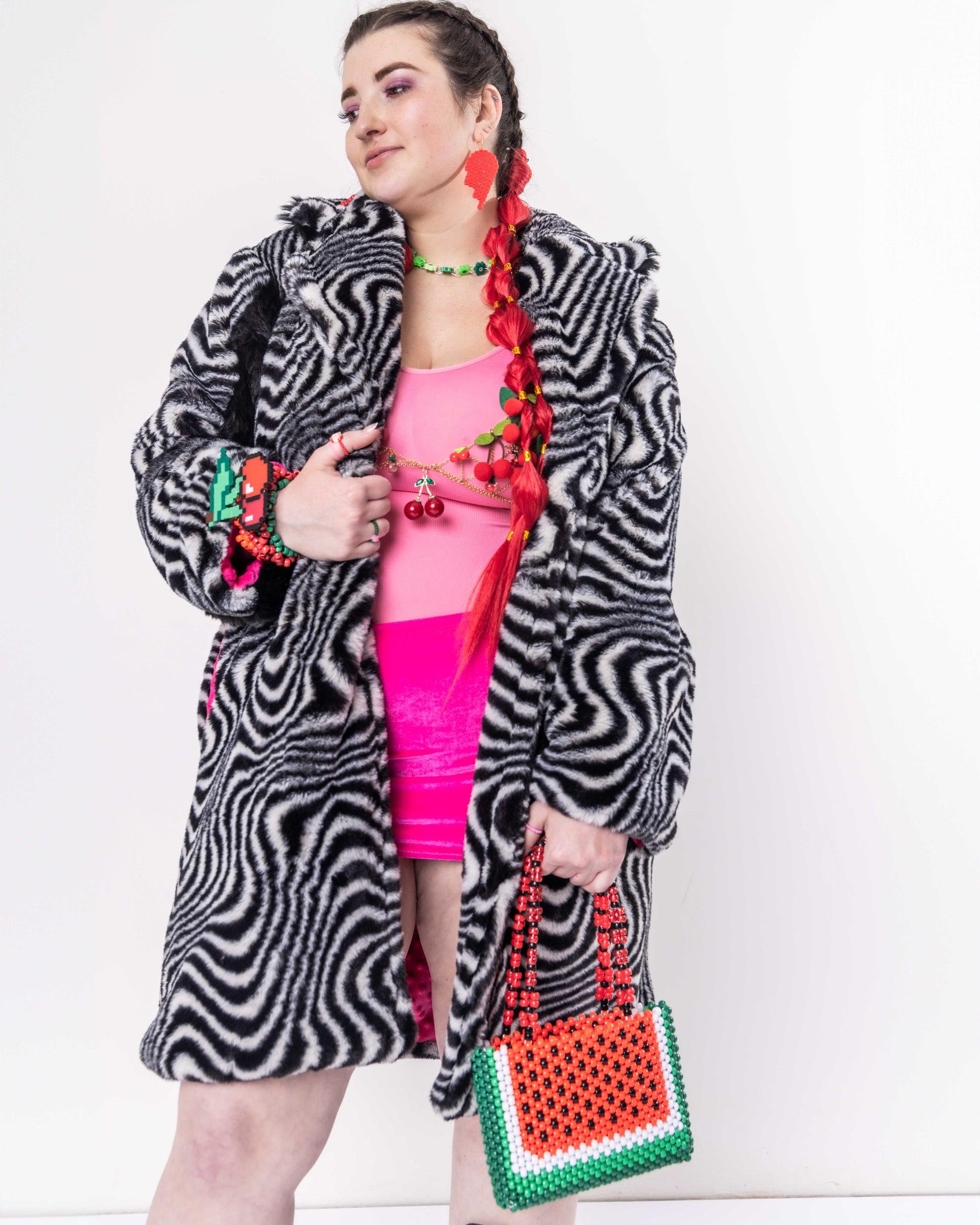 Woman wearing black and white striped faux fur coat