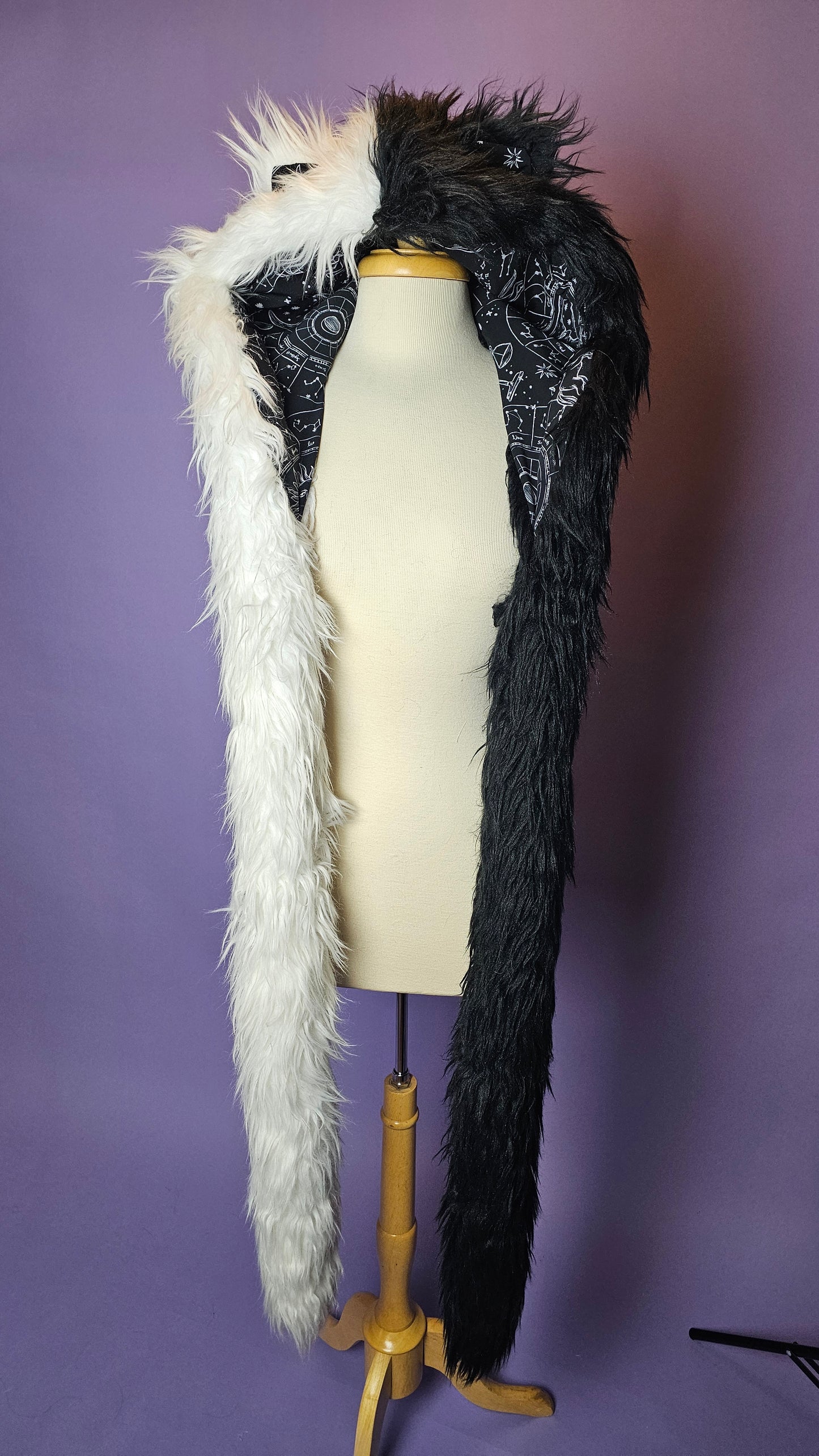 Black and white faux fur hood with animal ears.