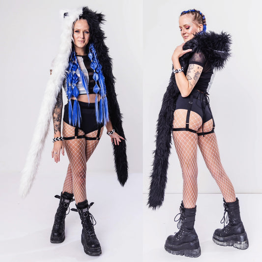 Model wearing black and white faux fur hood with animal ears.