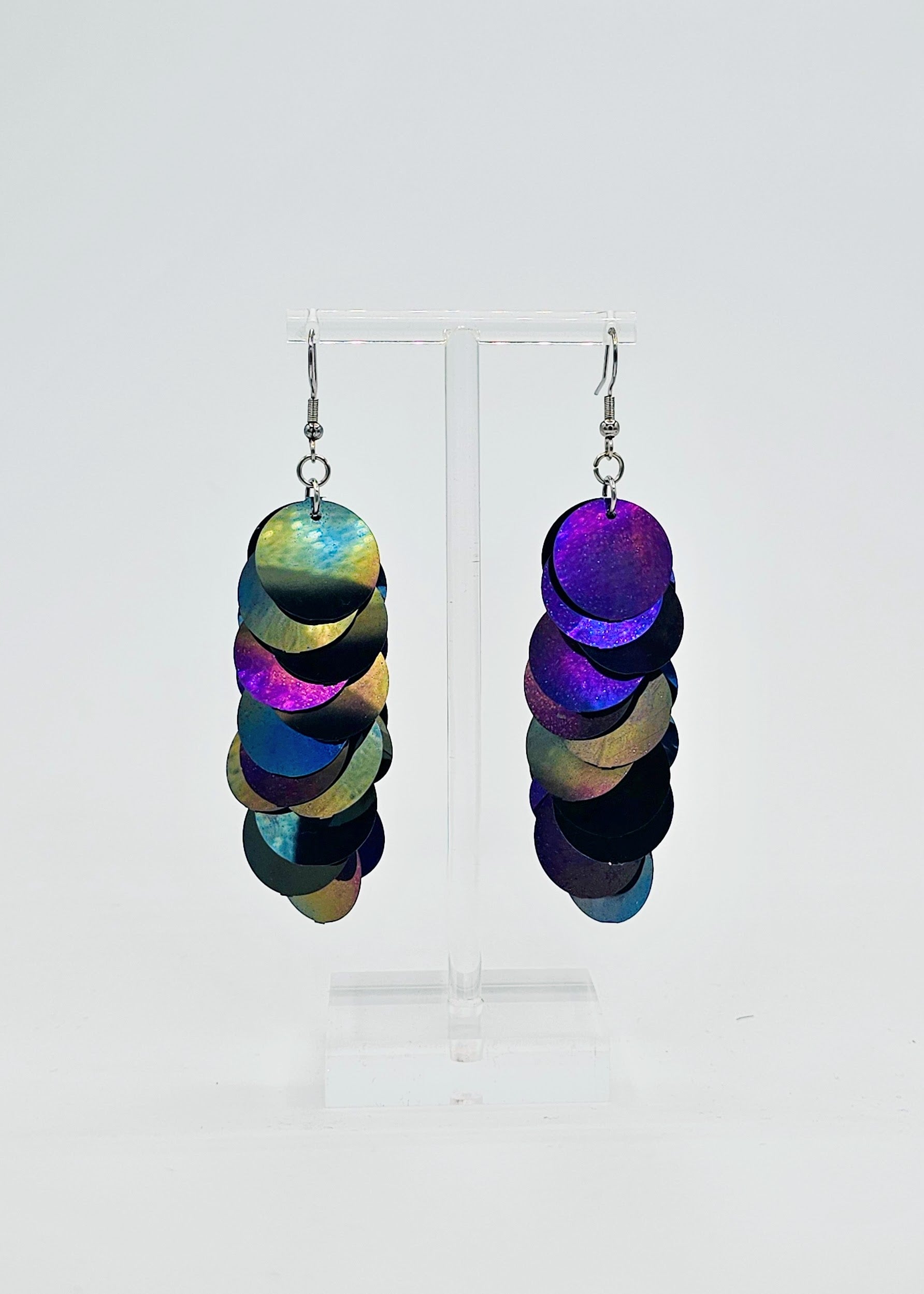 Black iridescent sequin earrings on white background
