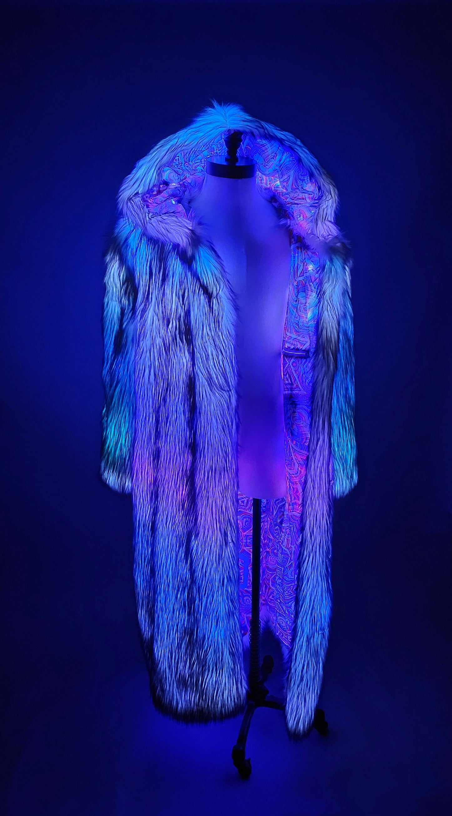 Purple faux fur coat with LEDs and colorful psychedelic lining.