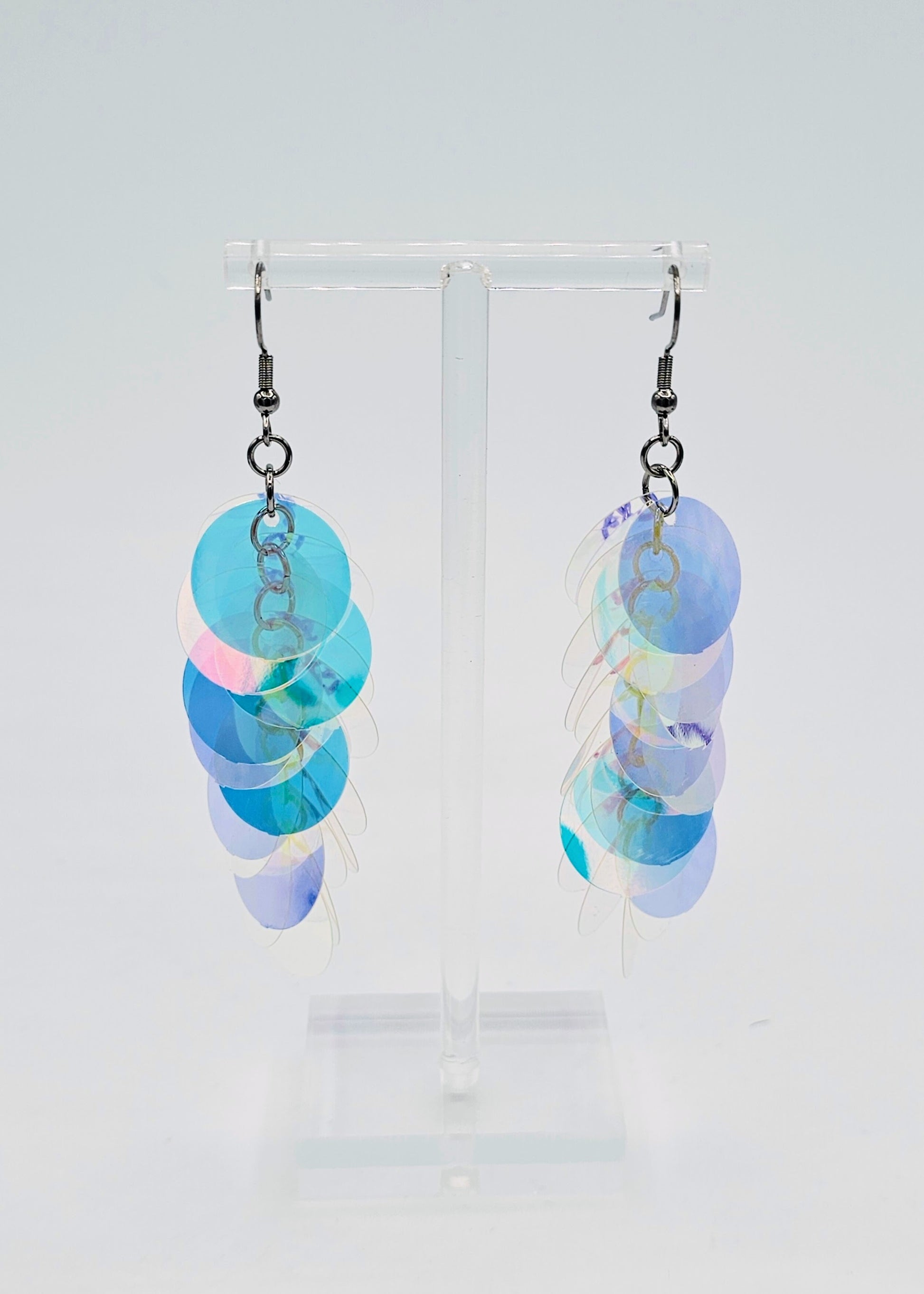 iridescent sequin earrings on white background