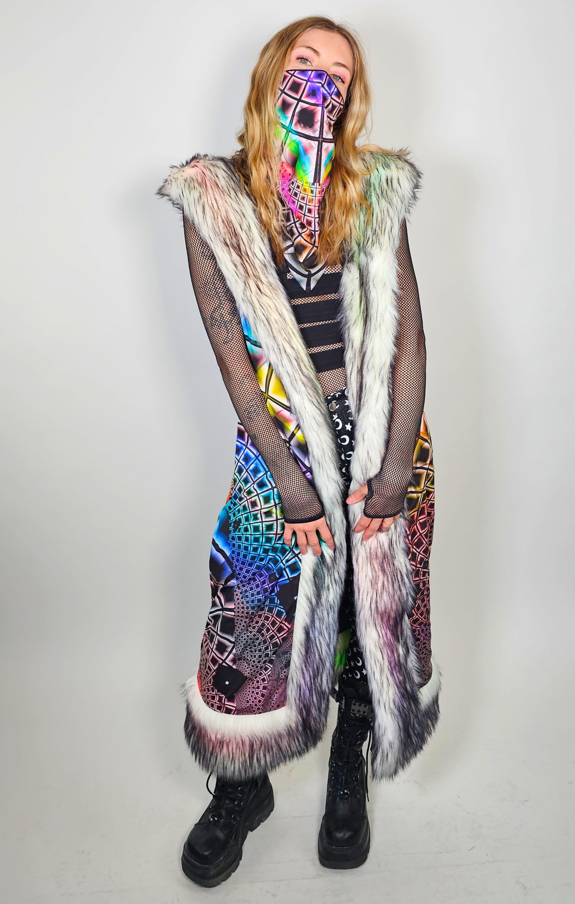 Person wearing duster with faux fur trim and matching mask