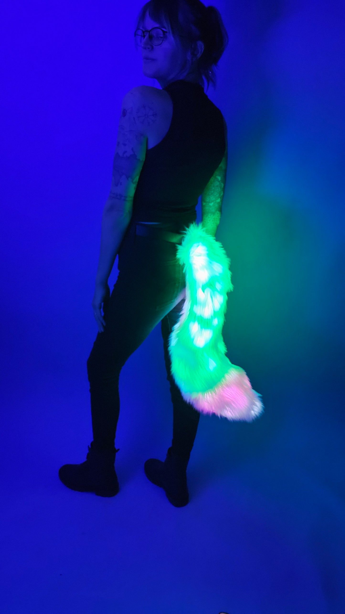 Green and white faux fur tail with LEDs.