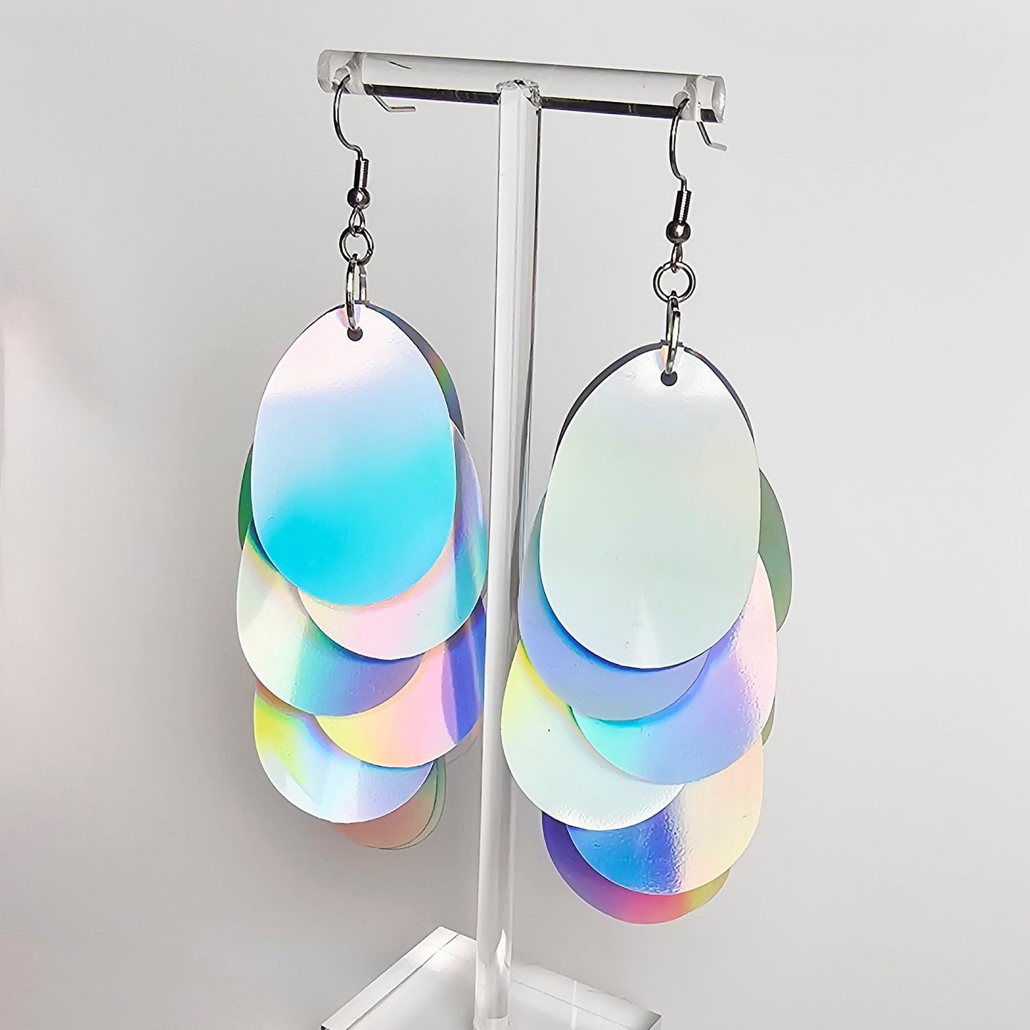 Earrings with large silver iridescent sequins.