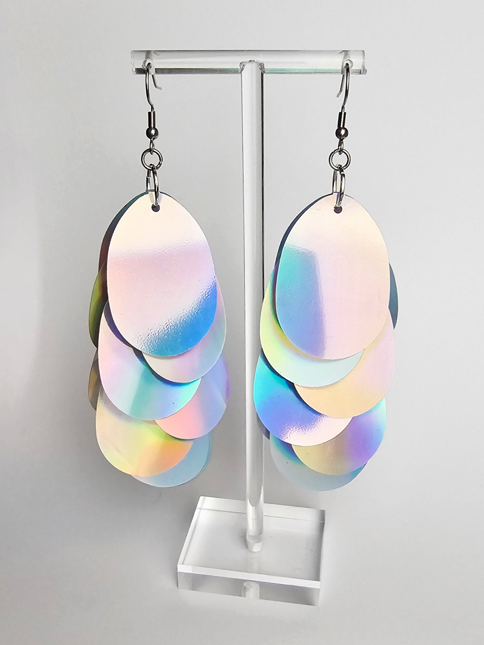 Earrings with large silver iridescent sequins.