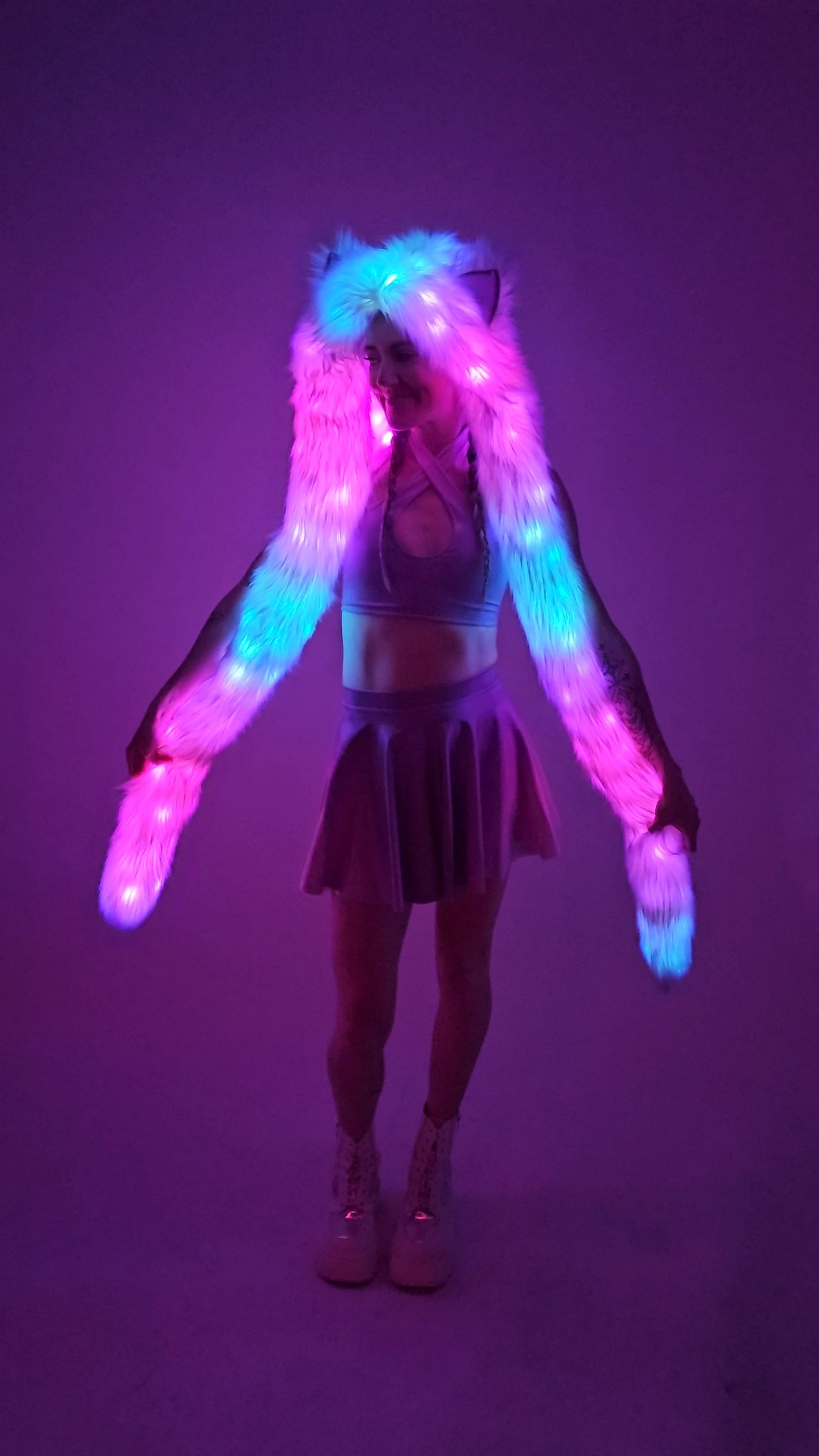 Model wearing faux fur hood with leds