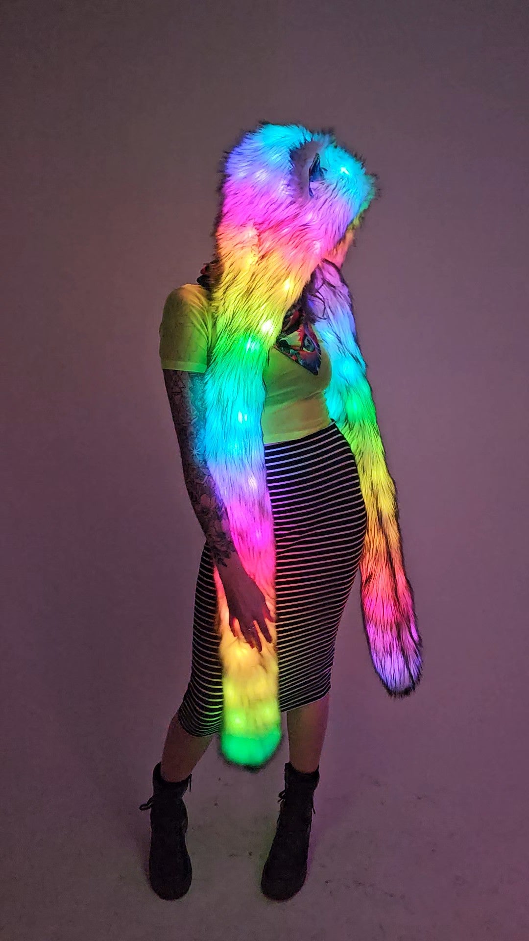 Model wearing faux fur hood with leds