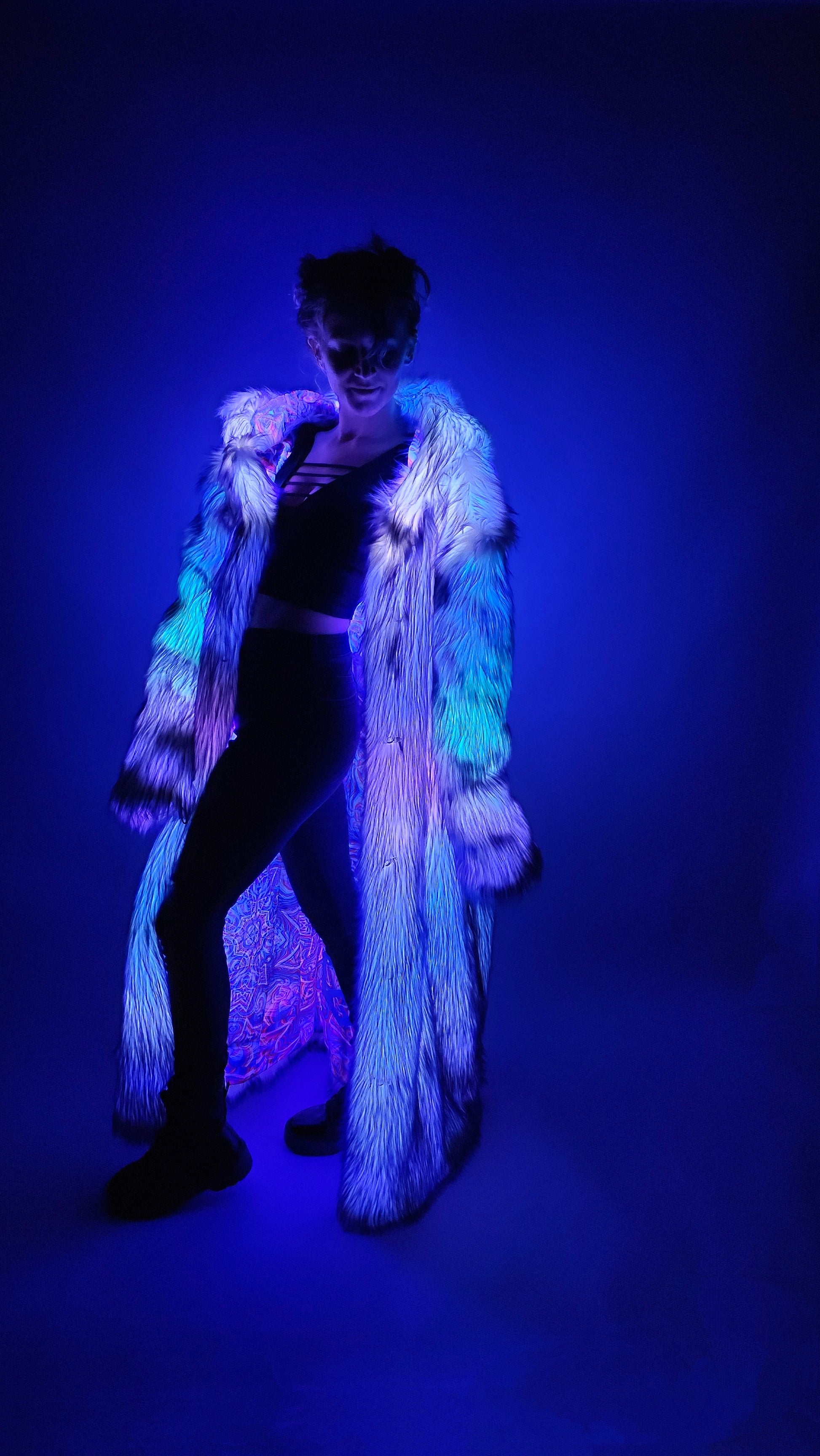 Purple faux fur coat with LEDs and colorful psychedelic lining.