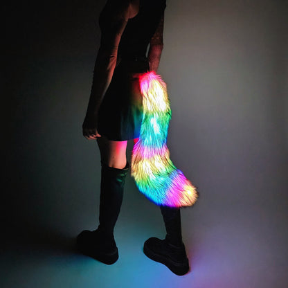 Person wearing medium LED faux fur tail with rainbow lights