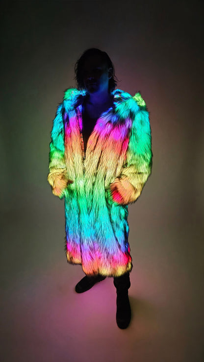 Person wearing a colorful, illuminated fur coat against a dark background