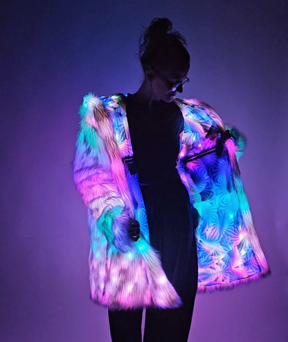 Person wearing a colorful LED jacket against a dark background