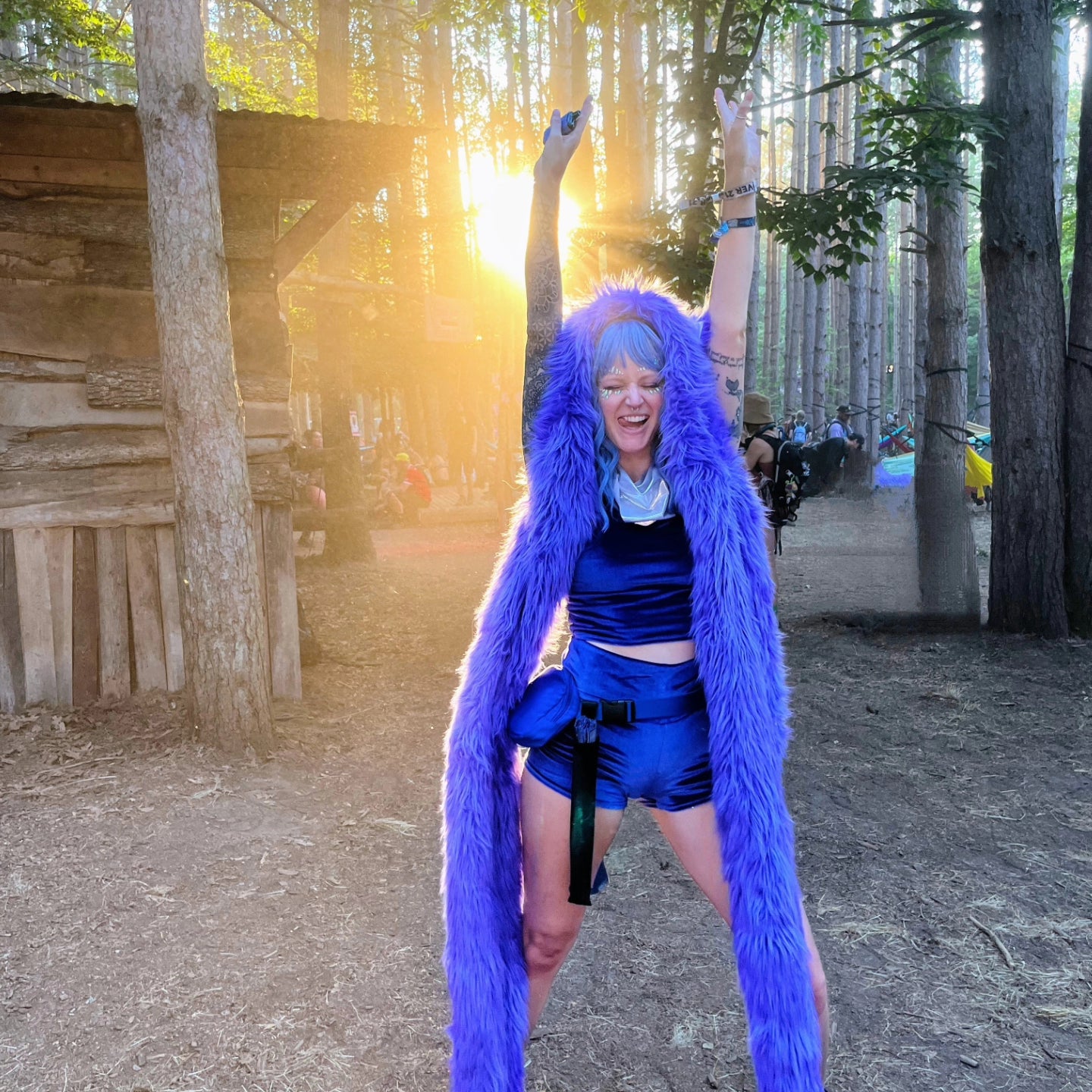 Woman at Electric Forest wearing a custom faux fur hood