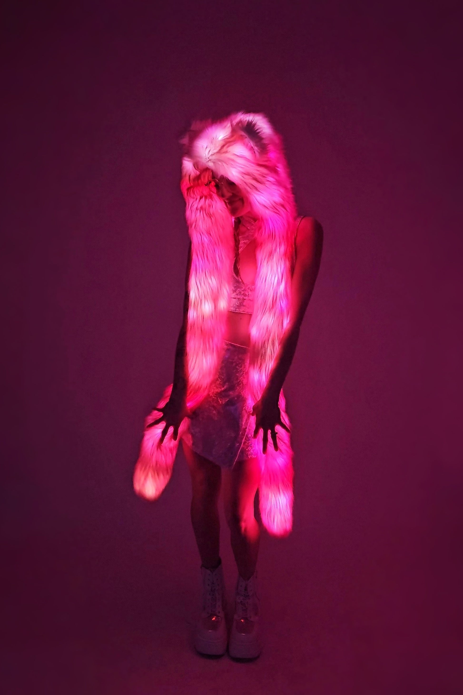 Model wearing pink hood with leds