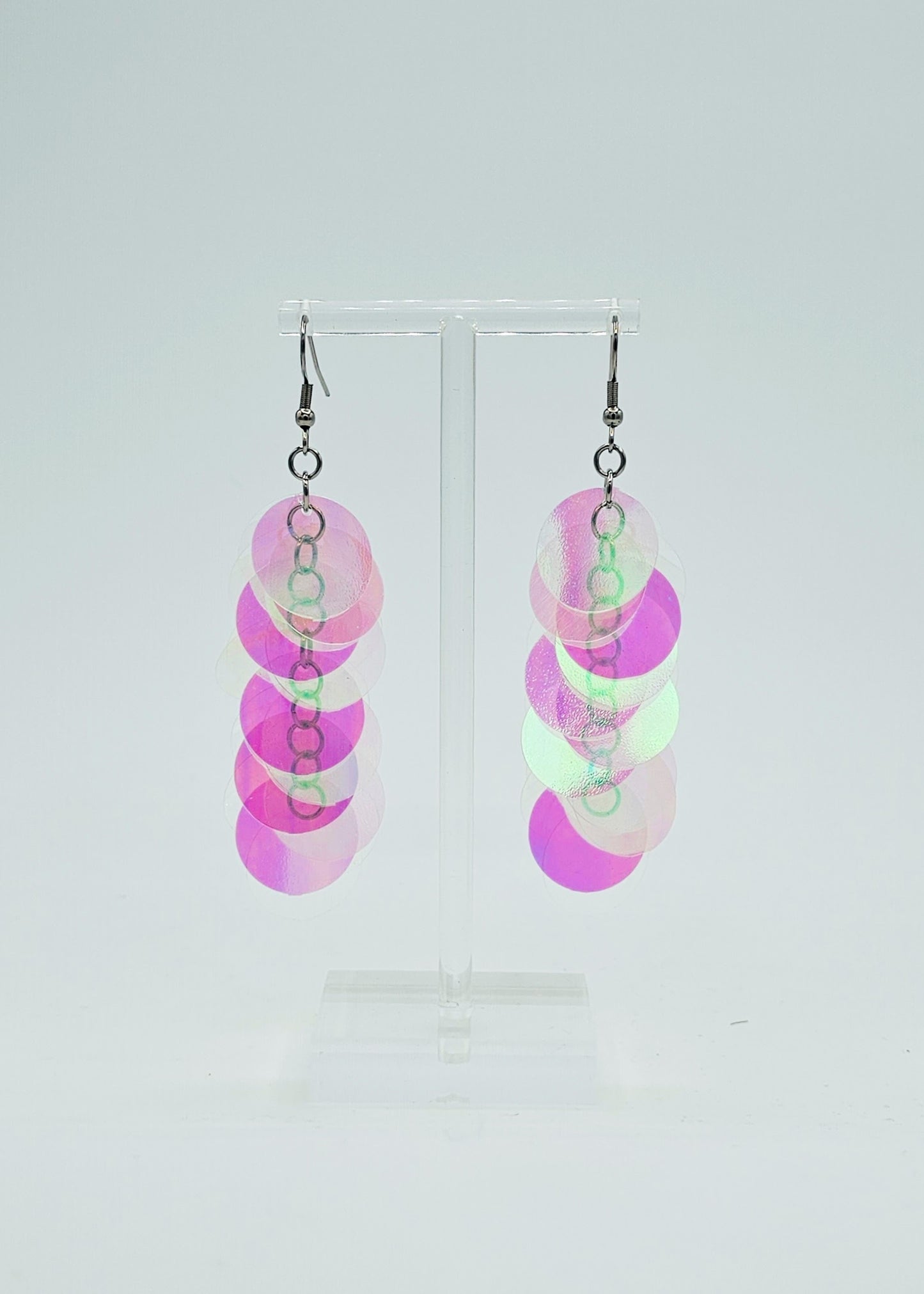 iridescent sequin earrings on white background