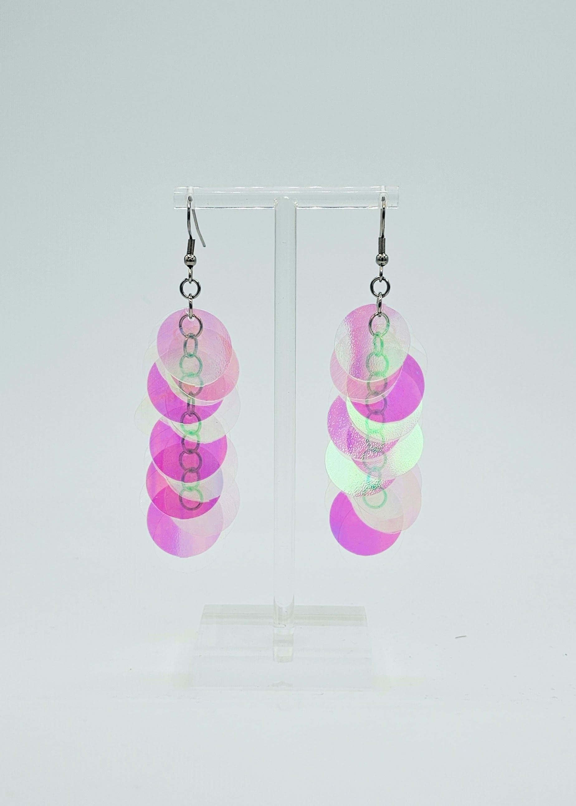 iridescent sequin earrings on white background