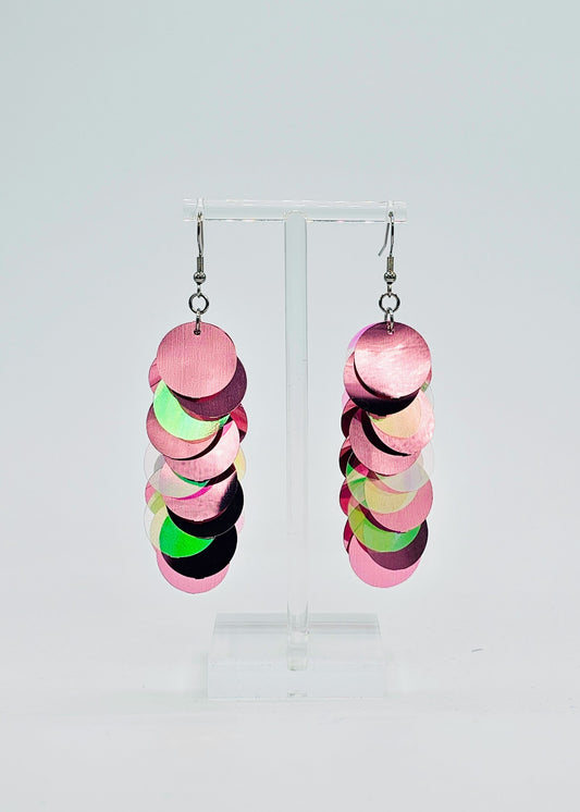 Pink iridescent sequin earrings on white background