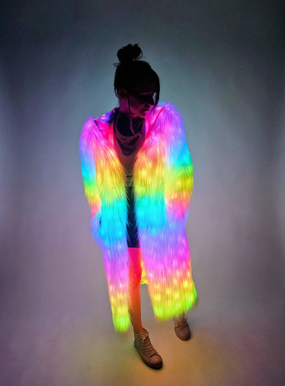 Person wearing a colorful LED jacket against a dark background