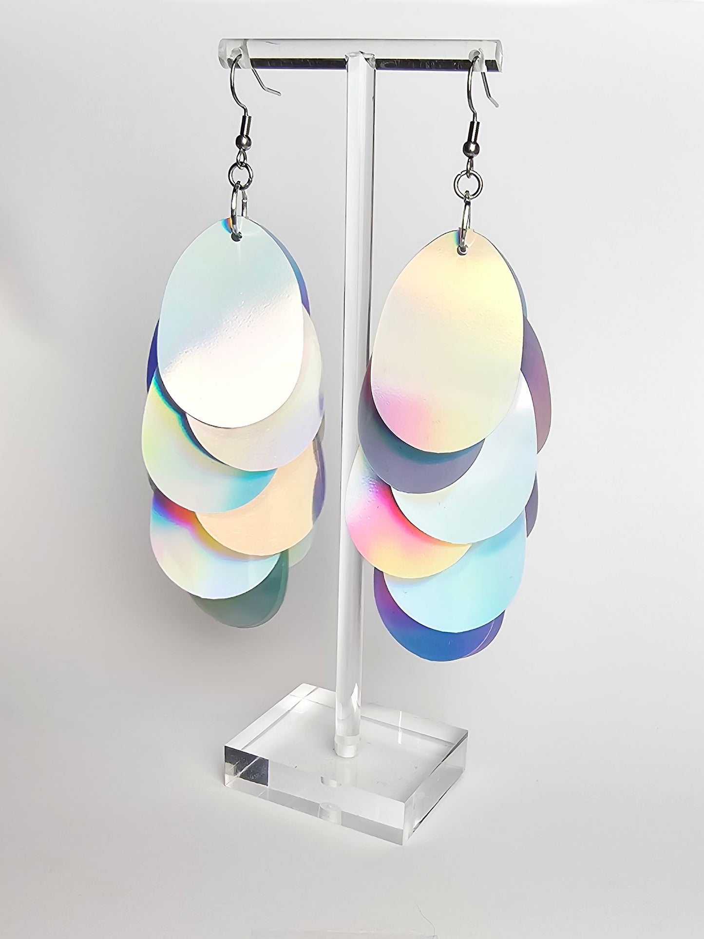 Earrings with large silver iridescent sequins.