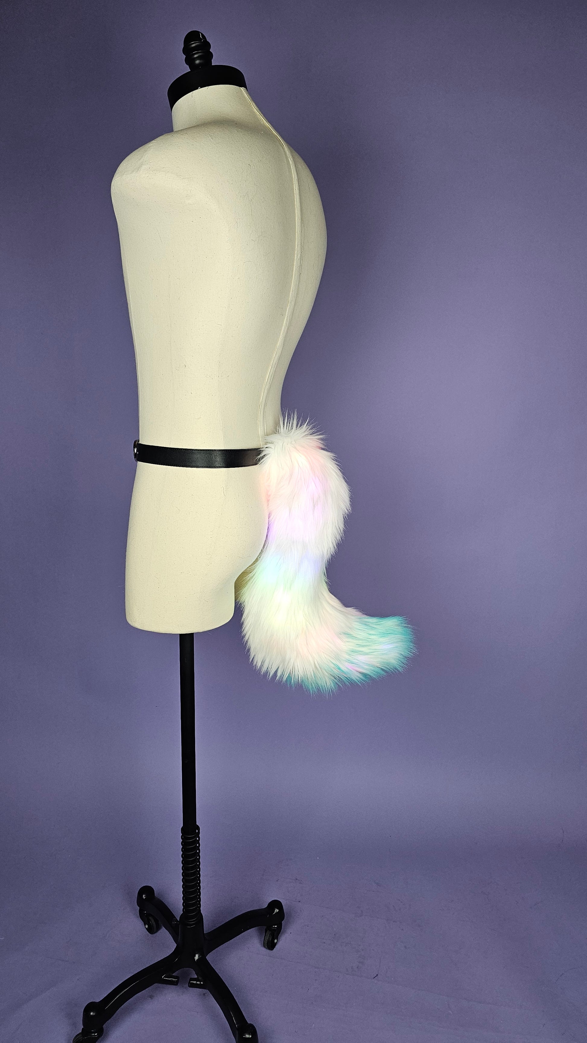 Small dynamic shape faux fur tail.