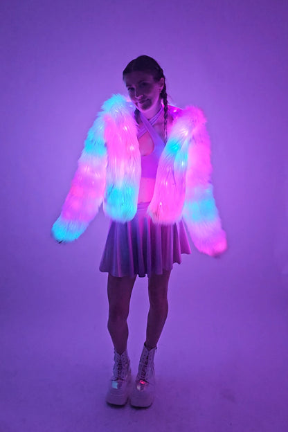 model wearing white LED coat illuminated with LEDs