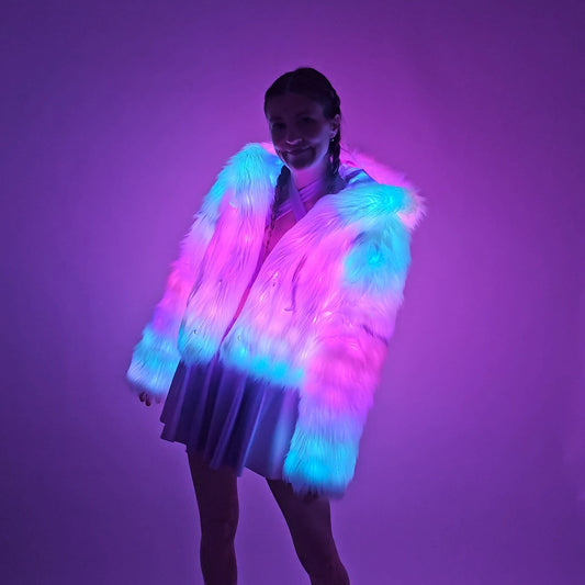 Model wearing white faux fur coat and lavender outfit