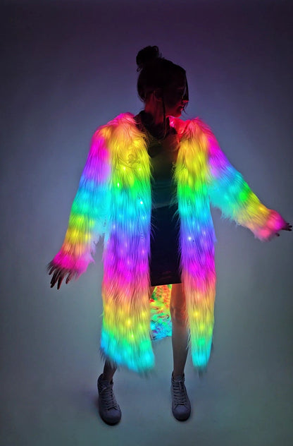 Person wearing a colorful LED jacket on a plain background