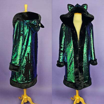 Mannequin wearing coat made with emerald green sequins, black faux fur trim and lining, and animal ears on the hood.