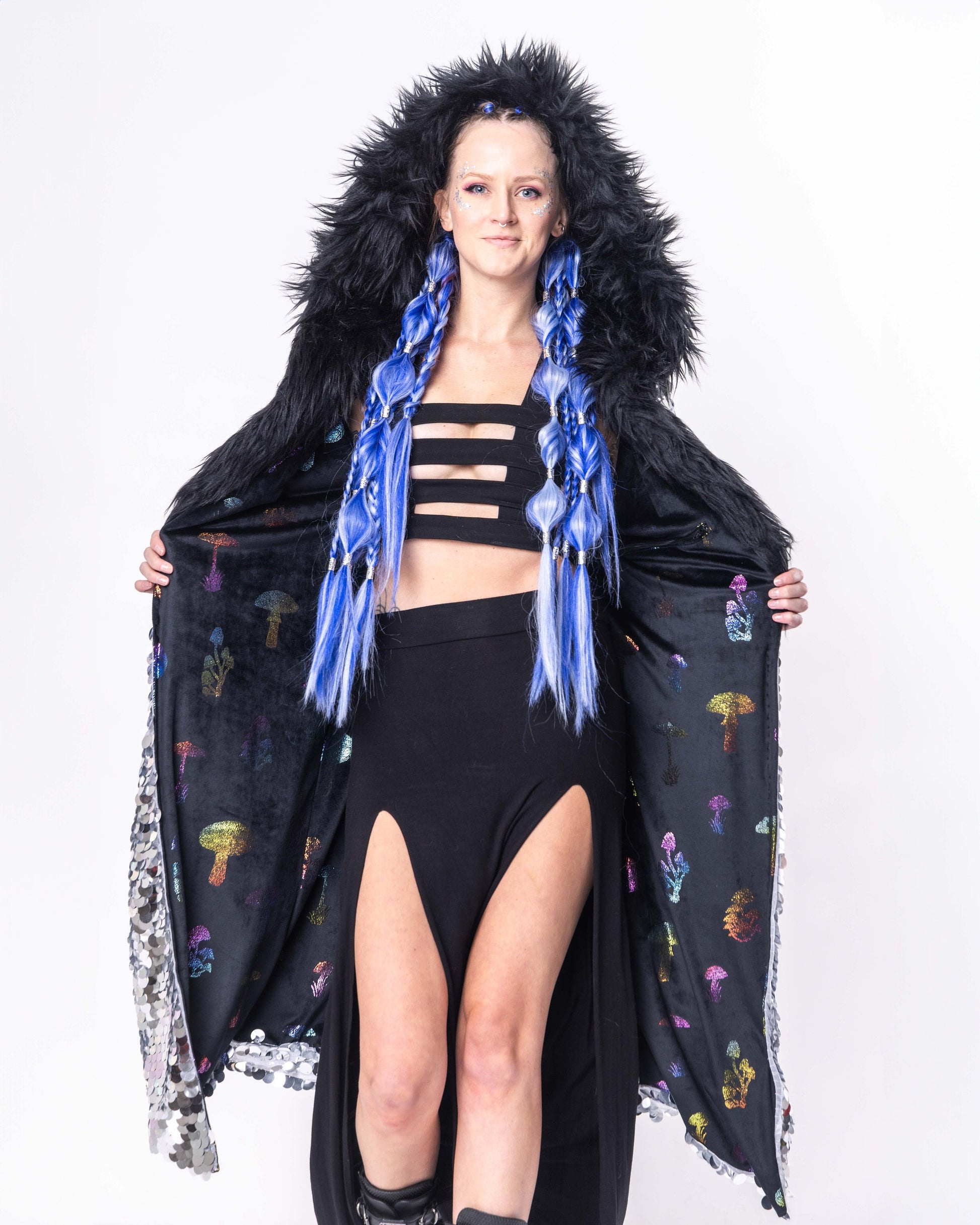 Model wearing Long coat made with silver sequins and black faux fur trim with black minky lining.