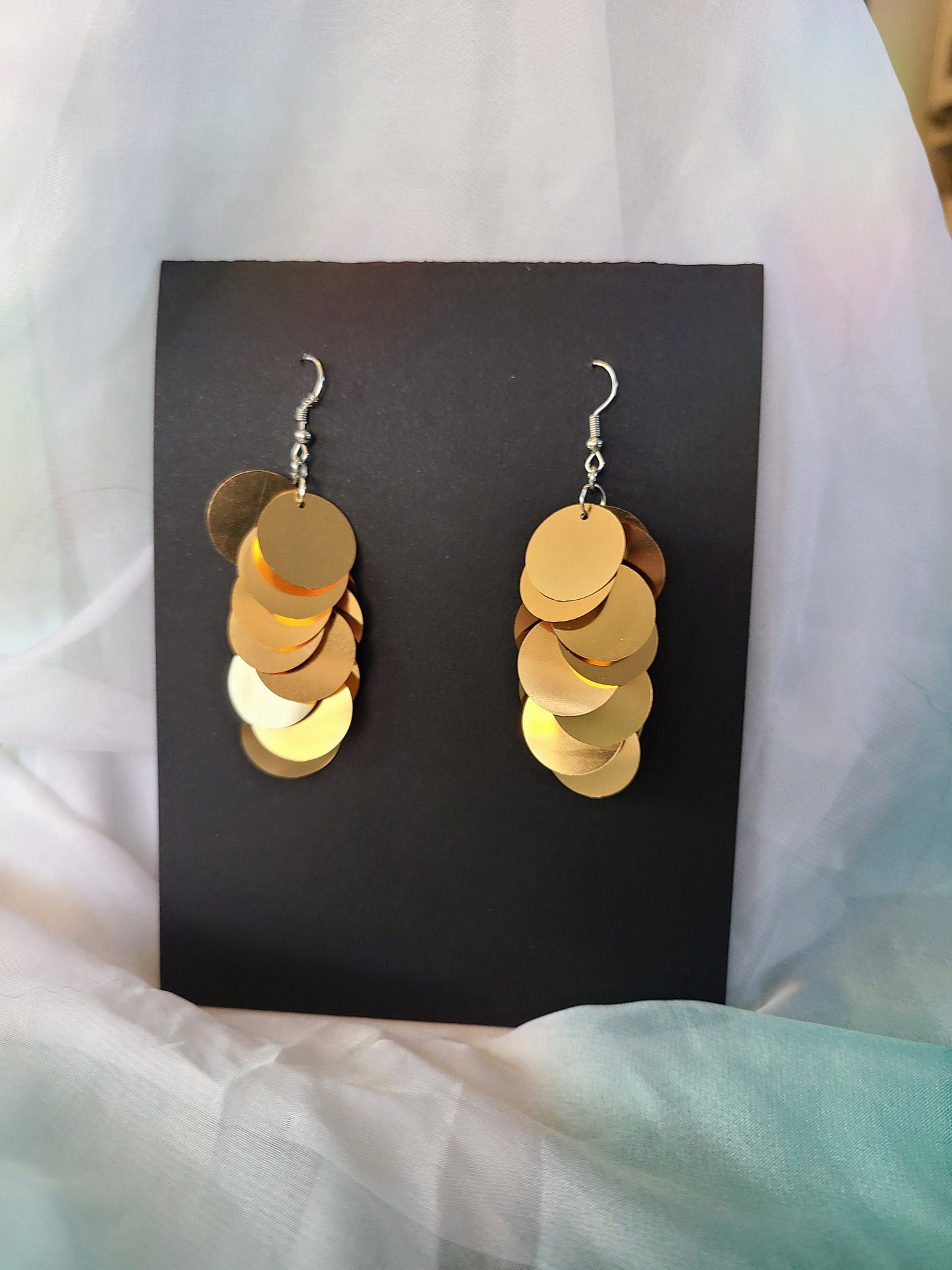 Gold sequin earrings with silver stainless steel hardware.