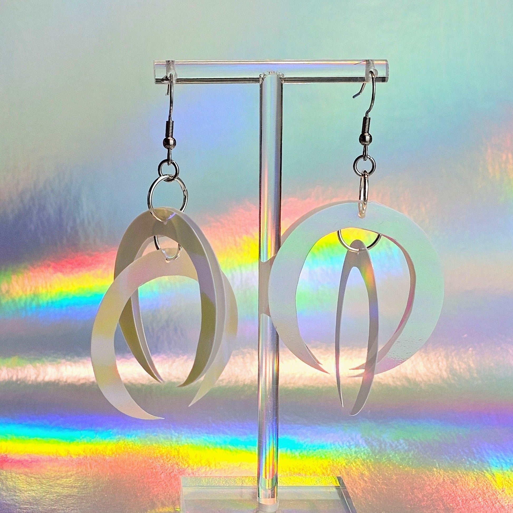 white iridescent crescent shape sequin earrings with silver stainless steel hardware