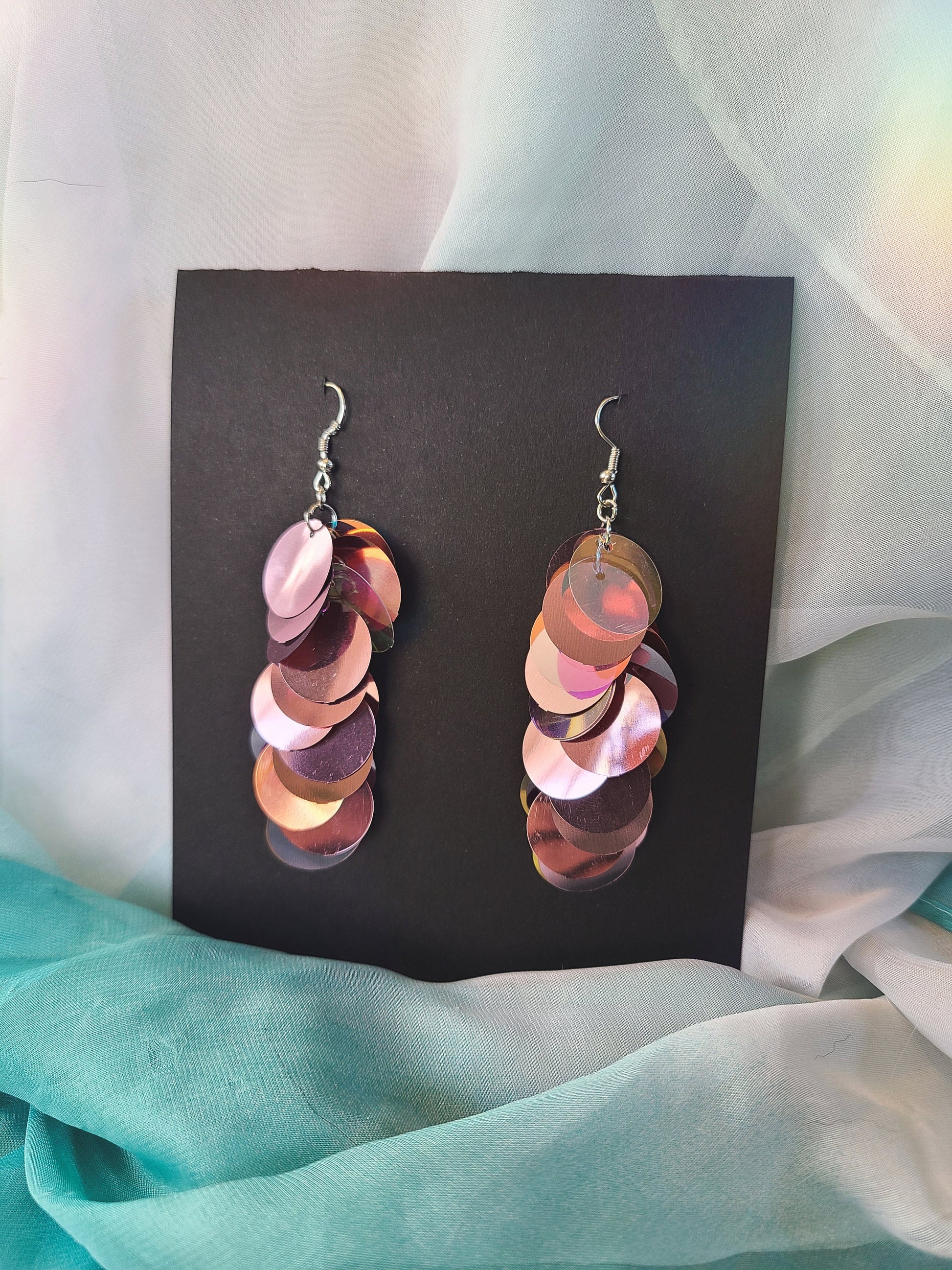 Metallic pink sequin drop earrings with silver stainless steel hardware.